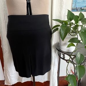 Coach brand short skirt with front pleat, size 12. Like new. Black.